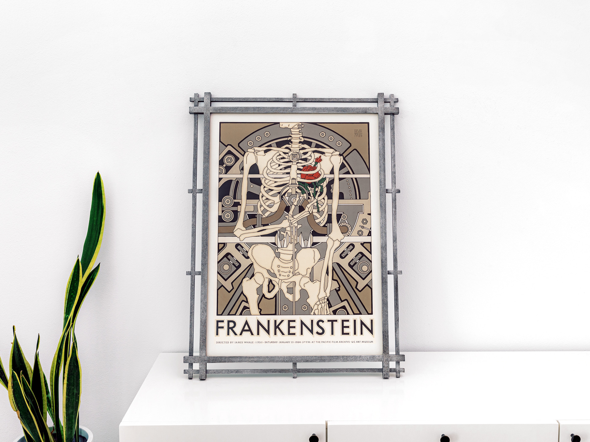 David Lance Goines Frankenstein poster framed in an artisan wood crossover corner frame with gray finish.