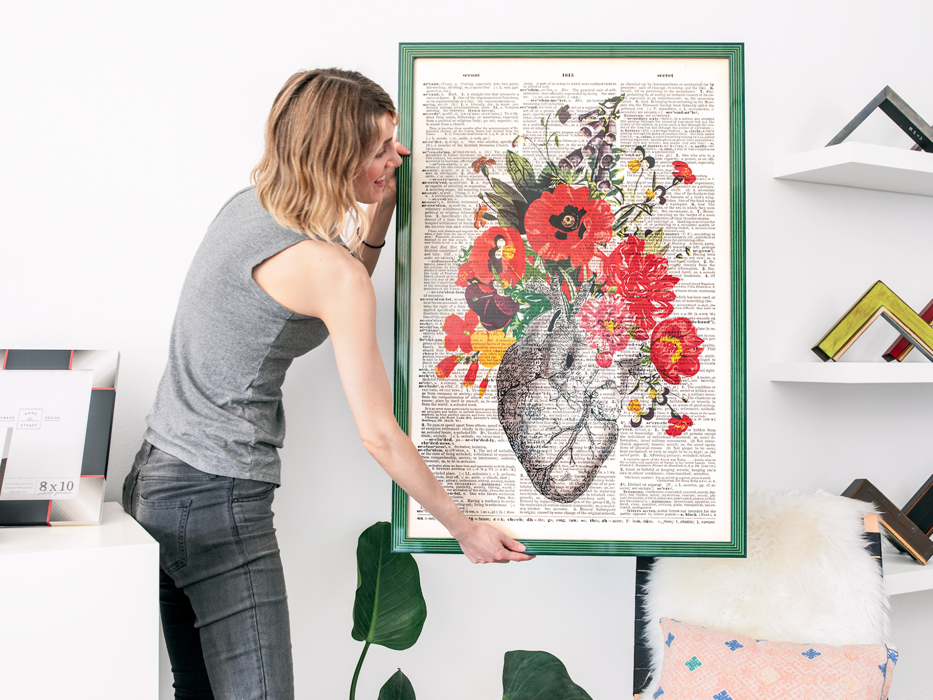 A vintage inspired botanical poster print is framed in a green striped semi-gloss frame.